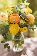 Yellow bouquet with roses and ranunculus