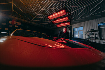 Modern Сar detailing. Lamp for drying