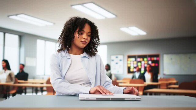Student Girl In Classroom Using Laptop