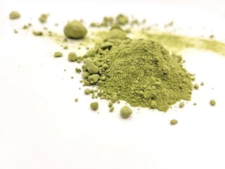 Pile of spinach powder on a beautiful white background.