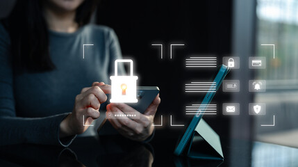 A person using a smartphone with a digital lock icon, indicating security measures in a modern, tech-savvy environment.