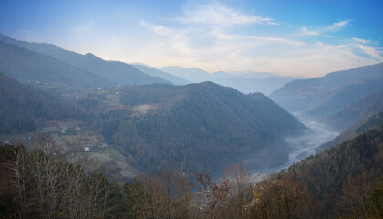 Sunny landscape of mountains, river and trees in Variaki, Georgia