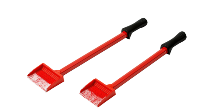 Red snow shovel pair designed for efficient snow removal in winter weather conditions