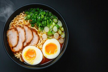 Rich bowl of ramen featuring tender pork, soft-boiled eggs, and