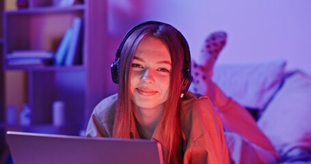 A Young Gamer Happily Enjoying a Late Night Gaming Session from the Comfort of Home