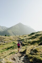 Fototapeta premium Hikers on a scenic mountain trail.