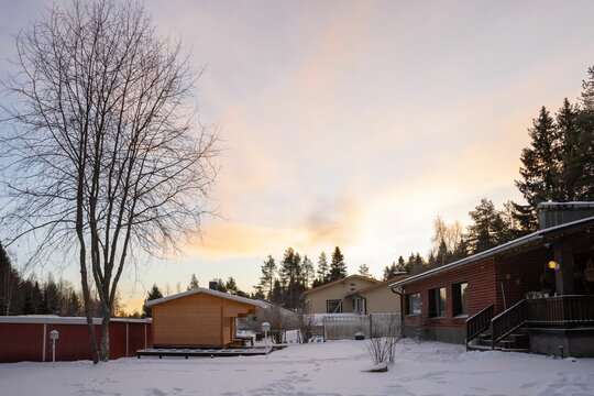 Winter suburban backyard at sunset - Powered by Adobe