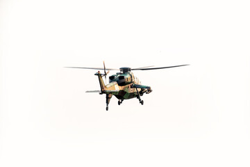 Helicopter flying away on isolated white background