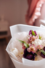 A beautifully arranged bouquet of fresh flowers wrapped elegantly, perfect for gifting on special occasions