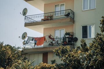 Residential Balconies with Hanging Laundry and Greenery