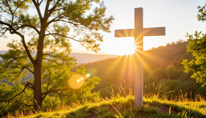 Cross illuminated by sunlight on a grassy hill for religious blogs, websites, spiritual designs, educational materials, faith-based presentations, and inspirational greeting cards