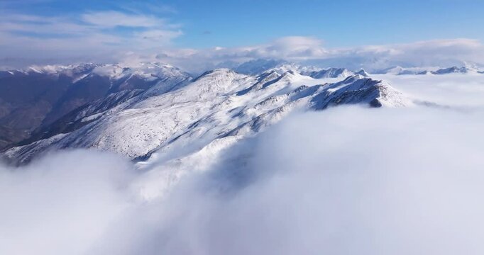aerial view of winter snow mountain landscape timelapse of clouds mist moving