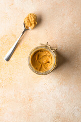 Delicious and healthy peanut butter on vintage  background