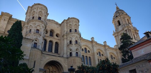 Architectural Majesty: A Glimpse of Gothic Elegance Under a Clear Blue Sky.