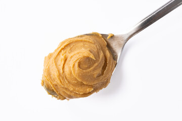 Delicious and healthy peanut butter on white background