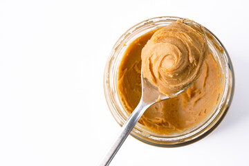 Delicious and healthy peanut butter on white background