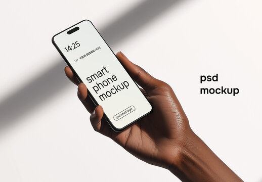 A hand holding a smartphone in a daylight setting - mockup