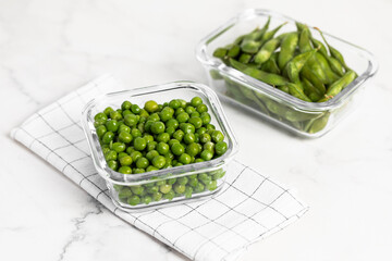 green peas in glass container for storage and cooking, healthy lifestyle, vegetable protein,...