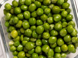 green peas in glass container for storage and cooking, healthy lifestyle, vegetable protein,...