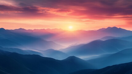 Vibrant Sunset Over Hazy Blue Mountains