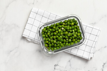 green peas in glass container for storage and cooking, healthy lifestyle, vegetable protein,...