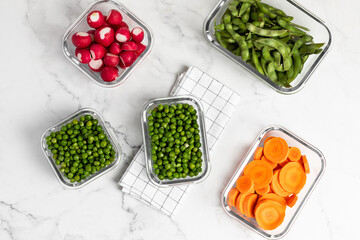 vegetables in glass containers for storage, healthy lifestyle, carrots, peas, radishes