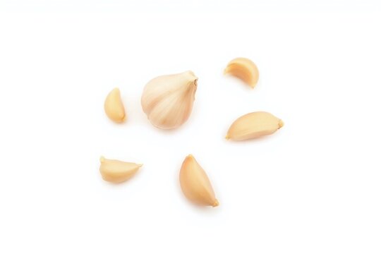 group of garlic cloves scattered white background fresh