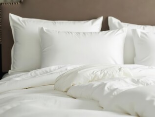 Comfortable bed with white linen and pillows inviting for a restful sleep