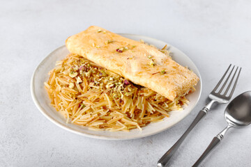 Balaleet - traditional Arabic breakfast. Sweet vermicelli with saffron, cardamom and egg omelette. Arabic, Emirati food.