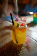 Refreshing cocktail with tropical garnish