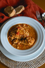homemade recipe of orange lentils with chicken on home stage
