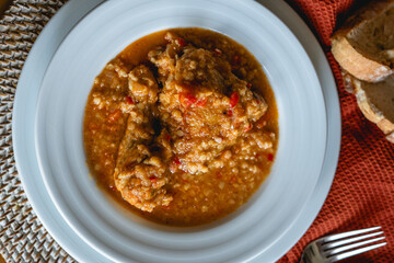 homemade recipe of orange lentils with chicken on home stage