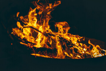 Dancing Flames in a Dark Surrounding Night