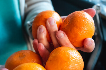 Clementines in a kitchen, citrus fruit containing beta carotene and vitamins