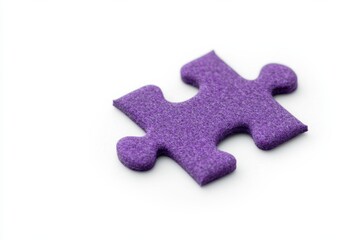 Obraz premium Purple puzzle piece with a textured matte surface on white background.