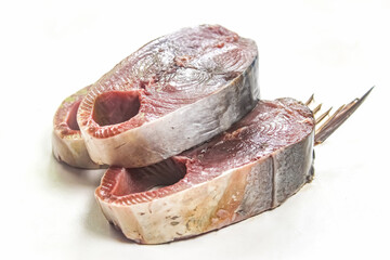 Obraz premium several pieces of raw tuna mackerel fish isolated on white