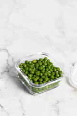 green peas in glass container for storage and cooking, healthy lifestyle, vegetable protein, potassium, fibervvv