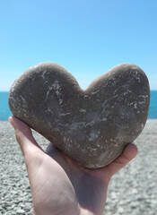 Heart of sea stone in hand