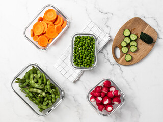 vegetables in glass containers for storage, healthy lifestyle, carrots, peas, radishes