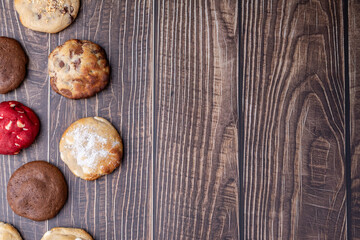 Assorted cookies over wooden table with copy space