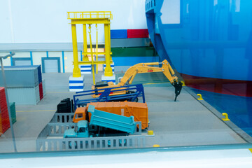 miniature excavator and truck. atmosphere at the shipping dock