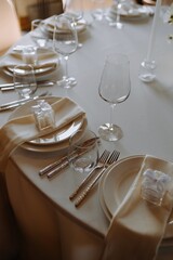 Elegant Table Setting with Glasses and Gift Boxes for Special Occasions