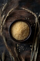 a bowl of grain next to wheat