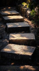 Serene stone pathway meandering through a lush green landscape under bright blue sky