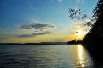 Summer sunset landscape, sunset over the Ural mountains and the Irtyash lake in Southern Urals,...
