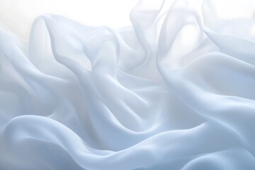 Fototapeta premium Soft, light blue silk fabric with elegant drapes and folds.