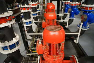 Row of industrial pumps used for refrigeration application to transport coolant, indrustrial refrigeration concept