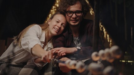 Enjoying a cozy evening with friends gathered together by the beautiful firelight