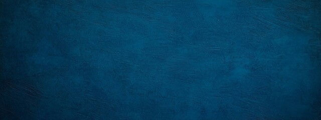 Dark blue background. Grunge blue background with copy space. Texture of decorative plaster on a concrete wall.
