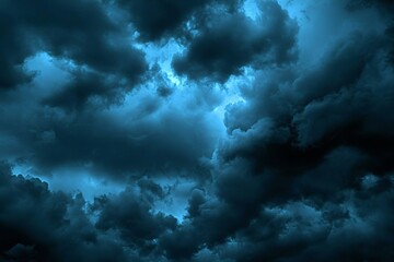 Black dark greenish blue dramatic night sky. Gloomy ominous storm rain clouds background. Cloudy thunderstorm hurricane wind lightning. Epic fantasy mystic.